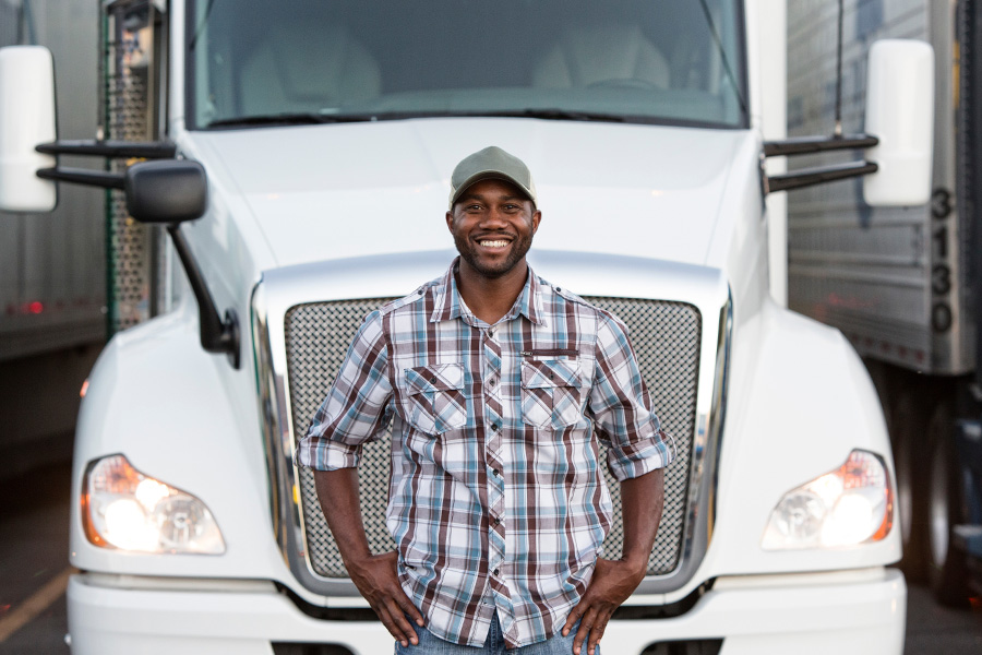 Man standing in front of semi truck
