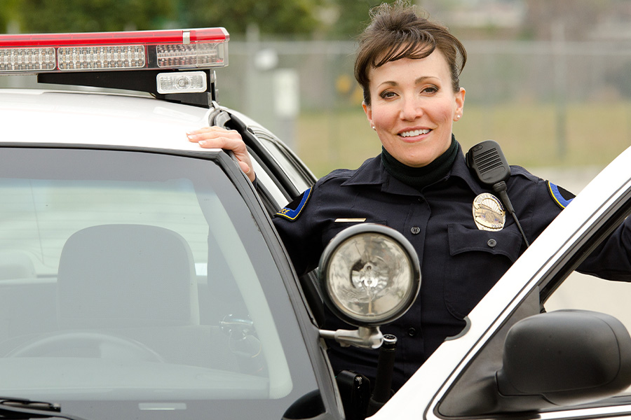 female officer and police car