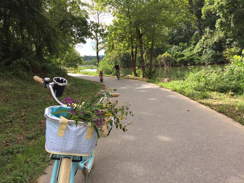 Stephanie's bike and family on the greenway