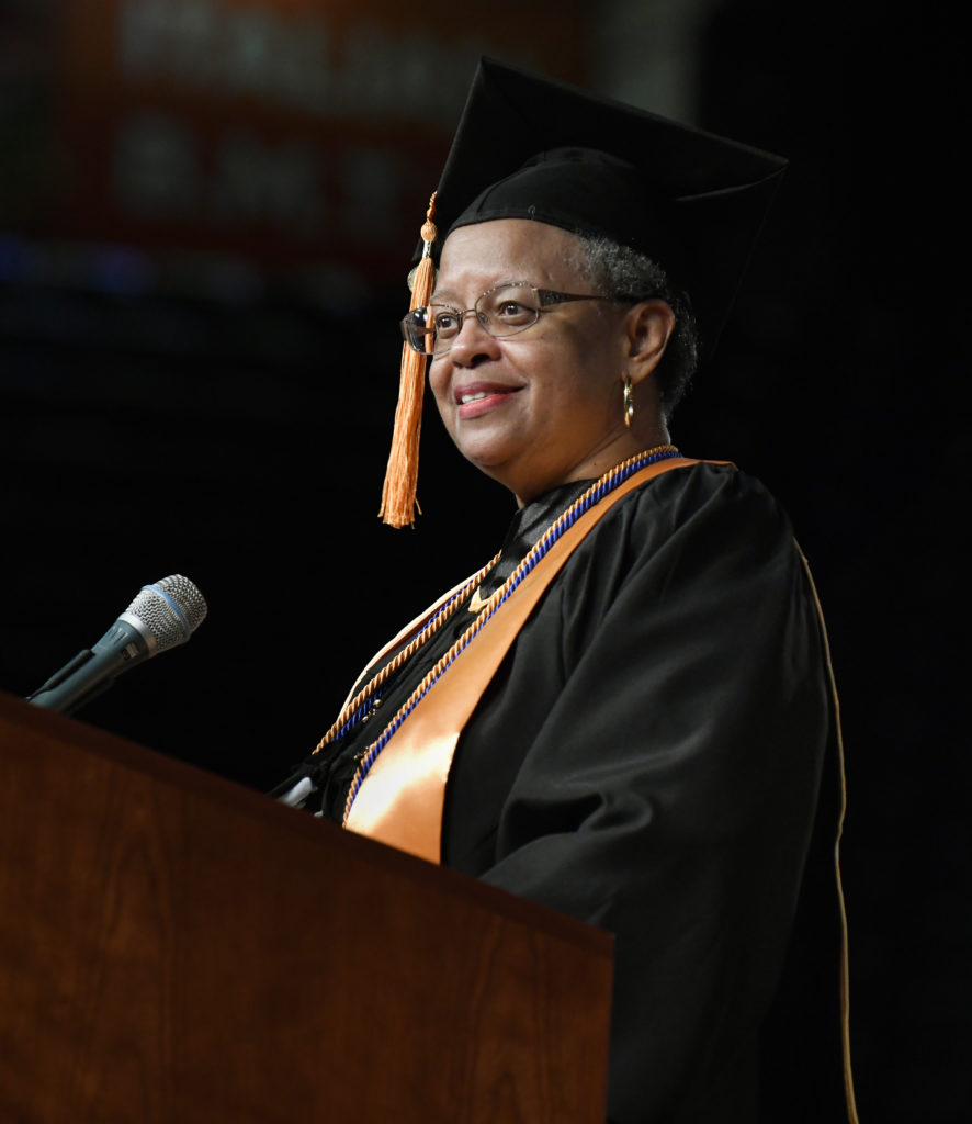 Vera Morton at podium during commencement
