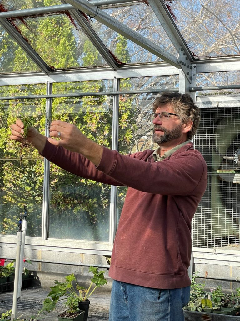 Clark BeCraft, coordinator of Virginia Western's Horticulture Program and Community Arboretum, shows students examples of cuttings that Virginia Western students are using to propagate plants in the College's greenhouse. BeCraft spoke about plant propagation and sustainability in a workshop that was part of the Earth Summit hosted by the Clean Valley Council at Virginia Western on Nov. 18. 