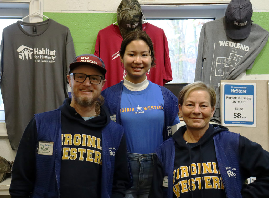 Rick Henegar (from left), Elitha Moe and Sarah Chitwood volunteer in the morning shift at the Habitat for Humanity ReStore in Roanoke.