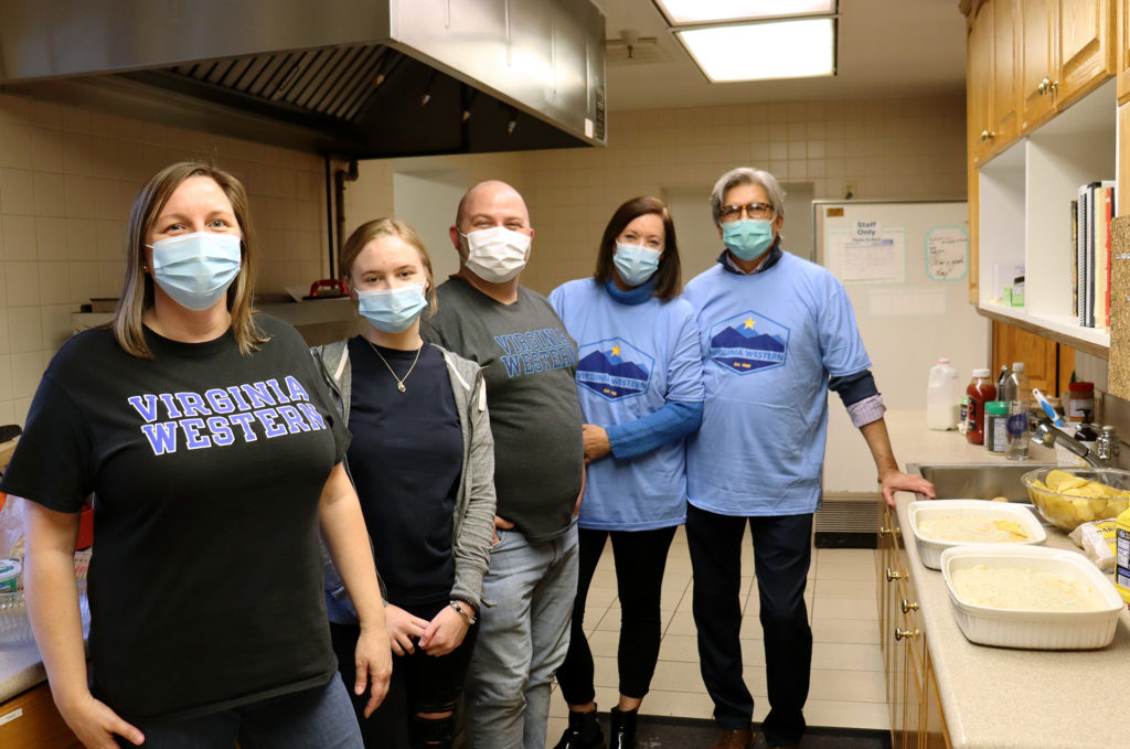 Virginia Western volunteers are seen in the kitchen at Roanoke's Ronald McDonald House (from left): Kitty Walls, Christine Widener, Ray Wickersty, and Amy and Andy Anguiano.