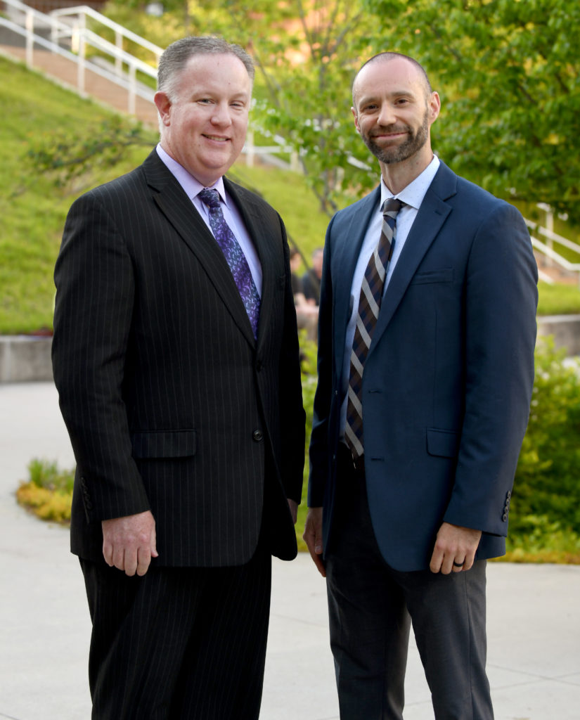 2022 Virginia Western Community College Distinguished Alumni honorees, Jason Peters and Elvir Berbic standing in front of Fralin Center