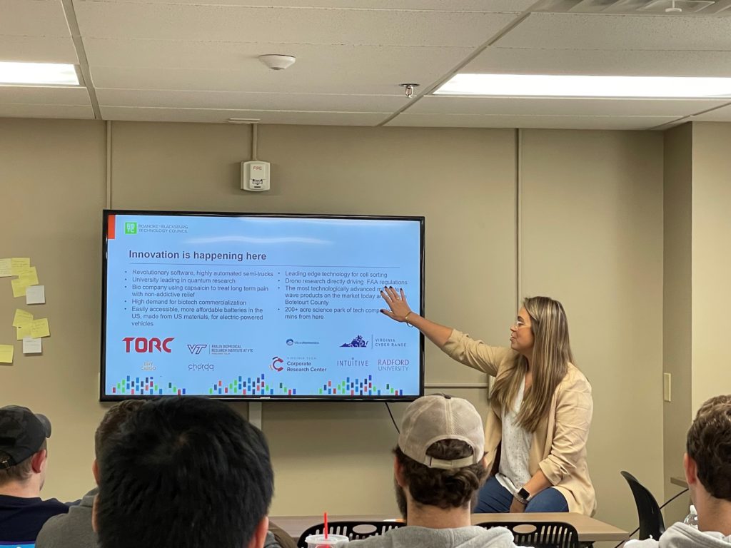 Taylor Spellman, associate director of the Roanoke-Blacksburg Technology Council, gives students examples of innovative firms and initiatives in the region.
