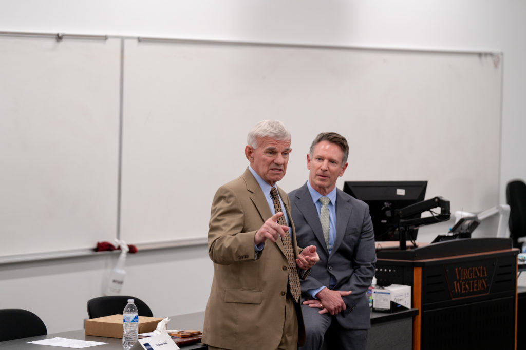 Dr. Robert Sandel speaks in a session with Dr. David Doré.