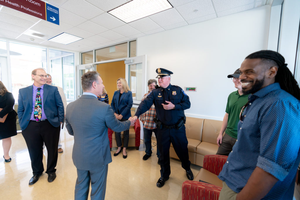 Virginia Western Police Chief Craig Harris greets Dr. David Doré.