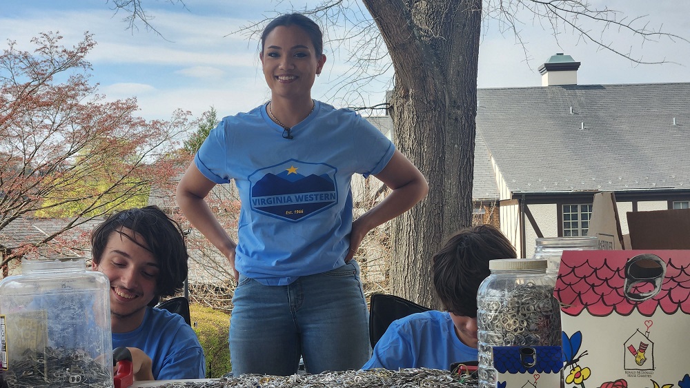 Virginia Western students Nikko Maiolo (from left), Briana Wood and Nate Girardeau help film the video for their entry in the Community College Innovation Challenge outside the Ronald McDonald House this spring.