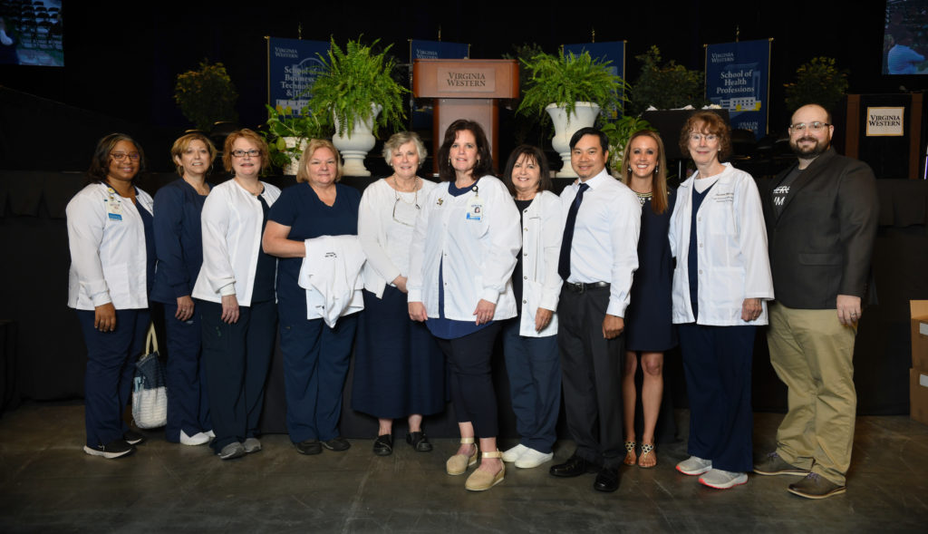 Virginia Western nursing faculty members, from left, at the 2022 Pinning Ceremony: Anita Chambers, Robin Wood, Julie McHugh Donovan, Hilda Taylor, Kathy Smith, Lauren Hayward, Terry Karet, Joe Nguyen, Darla Summers, Judy Fulcomer and Brandon Jones.