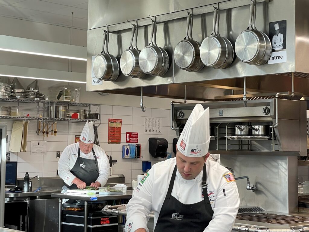 Team captain Chef Dan Holtgrave (left) and Chef Jim Storm work during the six-hour preparation window on Monday, Nov. 6.