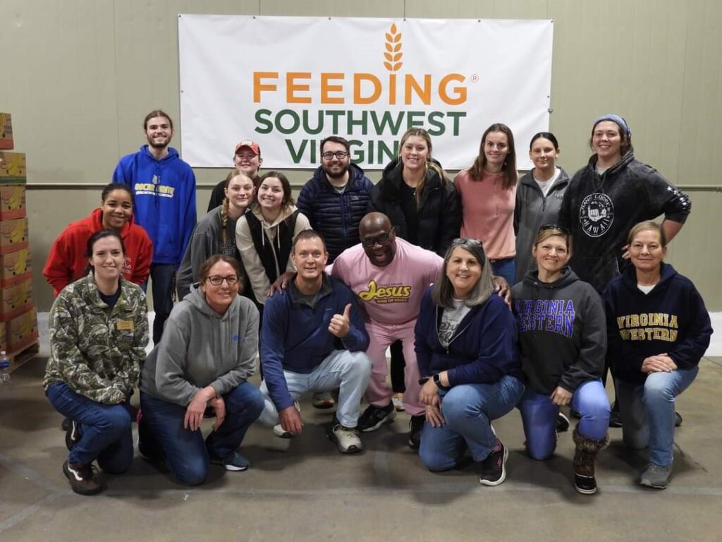 Feeding Southwest Virginia staff member James Andrews (front right) with volunteers on Jan. 12. The Day of Service included morning and afternoon shifts at the warehouse, and volunteers also prepared meals for the Children's Kitchen at the Solutions Center.