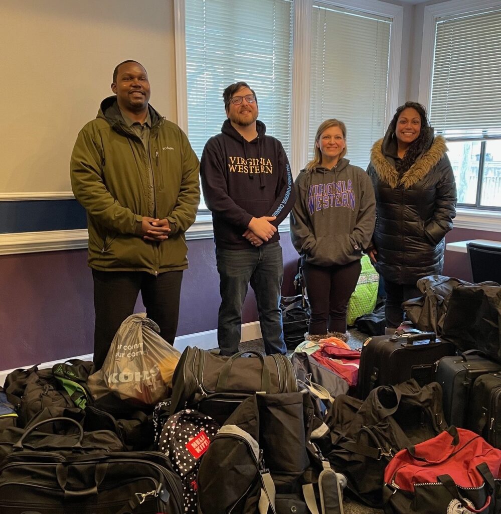 The Rev. Sean Burch (from left), J.W. Taylor, Jolene Hamm and Rachel Preston stand with donations from Virginia Western's Day of Service.