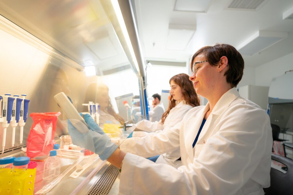 Faculty member Heather Lindberg and others work in the biotechnology lab.