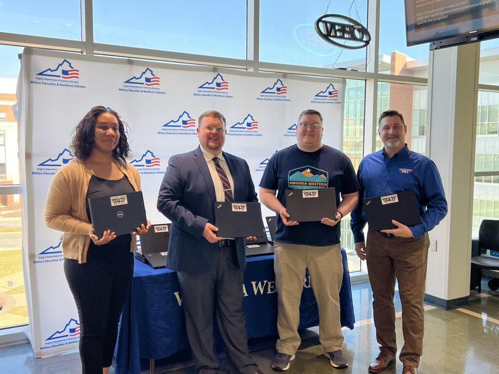 Present at the laptop event were (from left): Morgan T. Hyde, Military Education & Workforce Initiatives (MEWI) specialist for the Virginia Department of Veterans Services (DVS); John Hall, Military Education & Workforce Initiative (MEWI) program manager, Virginia Department of Veterans Services (DVS); Brandon Snead, VERITAS veteran liaison, Virginia Western Community College; and Jack Raymondson, business development, Tech 4 Troops.