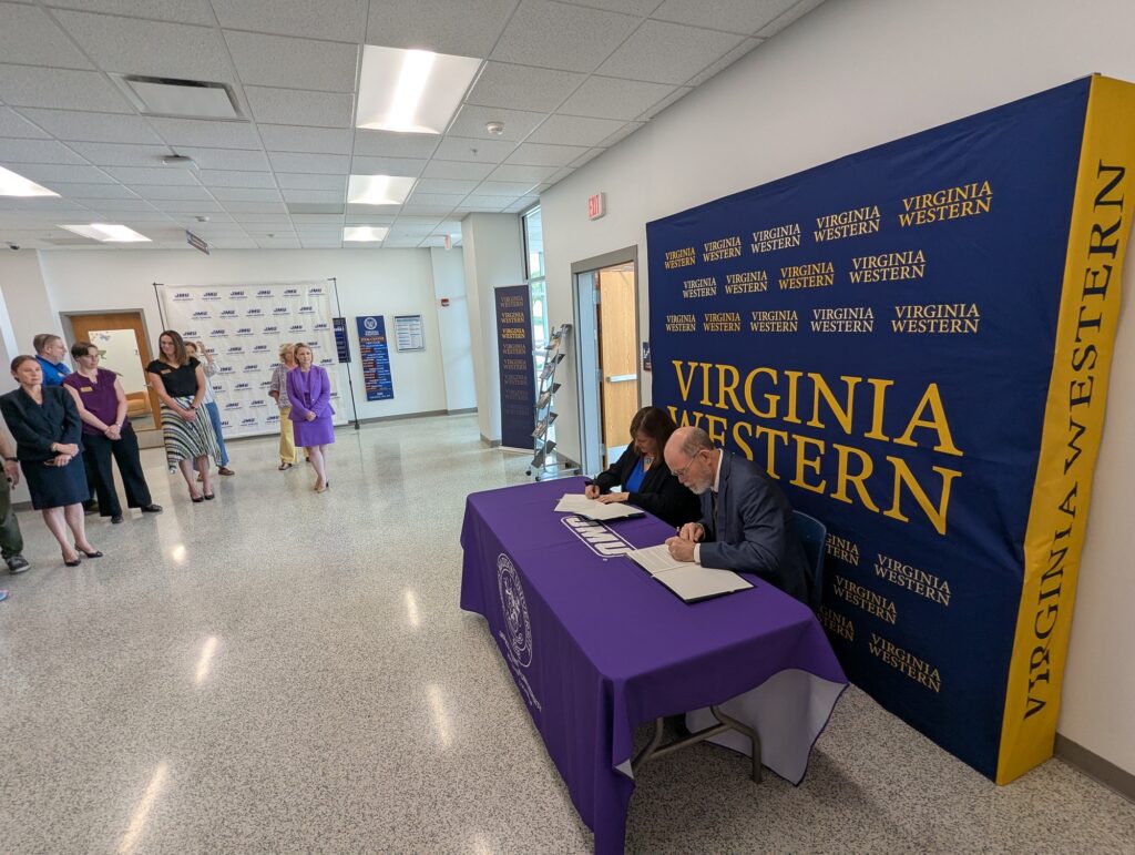 Virginia Western's vice president of academic and workforce solutions, Dr. Elizabeth Wilmer, and James Madison University's interim provost, Dr. Bob Kolvoord, signed an articulation agreement on Monday, May 19, that will result in a seamless transition for students focusing on the field of biotechnology.