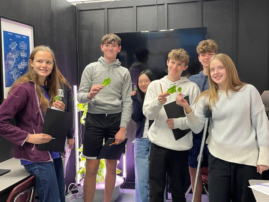 Engineering students at Roanoke County's Burton Center for Arts & Technology show part of the class lettuce harvest Oct. 24.