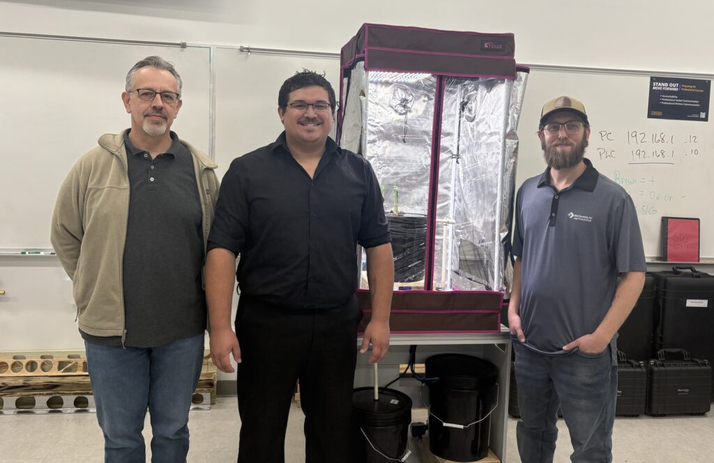 Dr. David Berry (left), leads the College's Mechatronics program. He mentored Daniel Moran (middle) and Timothy Boyd, the third cohort of students sponsored by Steel Dynamics.