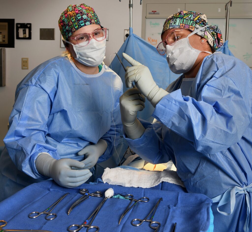 Onaca Umak (left) with Surgical Technology Program Director Morgan Boyd.