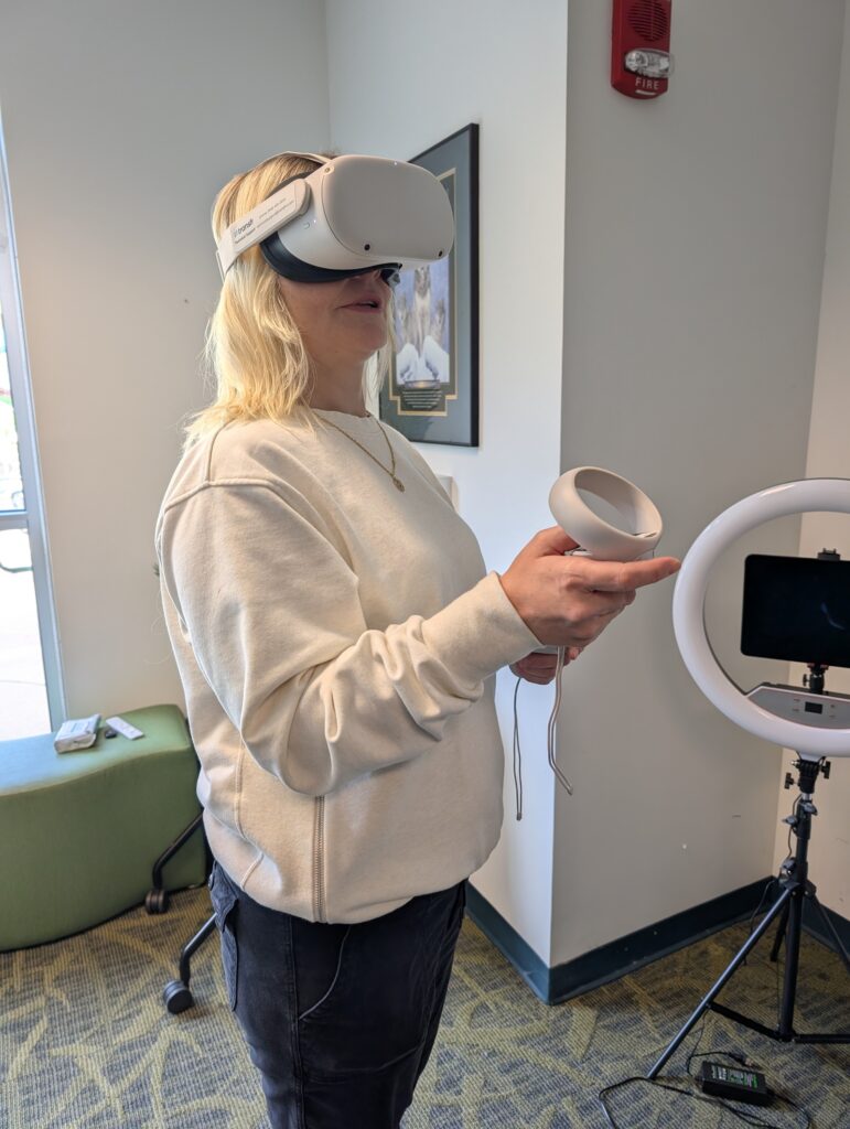 At the Hall Associates Career Center, Virginia Western student Michelle Brown uses the virtual reality headset with career exploration modules from Transfr Trek.