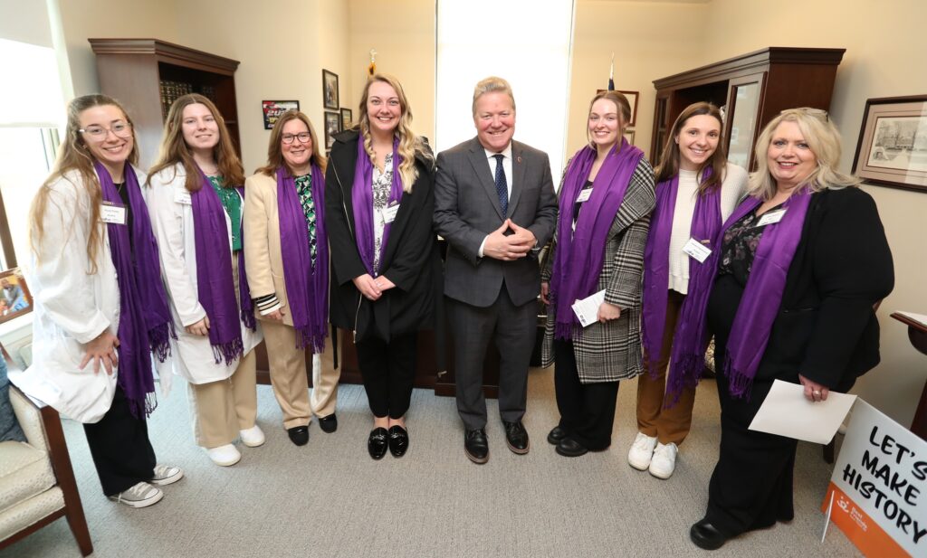 Virginia Western student Julia Roadcap (center, in black coat) with Sen. Bill Stanley, accompanied by Sheri Moore (third from left, Virginia Western Clinical Instructor and former President of the Virginia Dental Hygienists' Association) and Joanie Bryant (far right, Dental Hygiene Instructor and Coordinator for Rally Day), along with dental hygiene students from Laurel Ridge Community College Jenna Kemler and Emma Hammond (third and second from right), and students from Old Dominion University and Virginia Commonwealth University. Photo by Joe Mahoney.