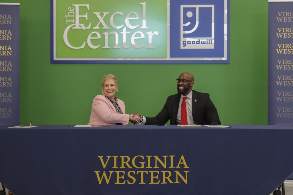Dr. Laura Treanor, President of Virginia Western Community College, and Richmond Vincent, President and CEO of Goodwill Industries of the Valleys, mark the signing of a collaborative agreement on Friday, March 13.