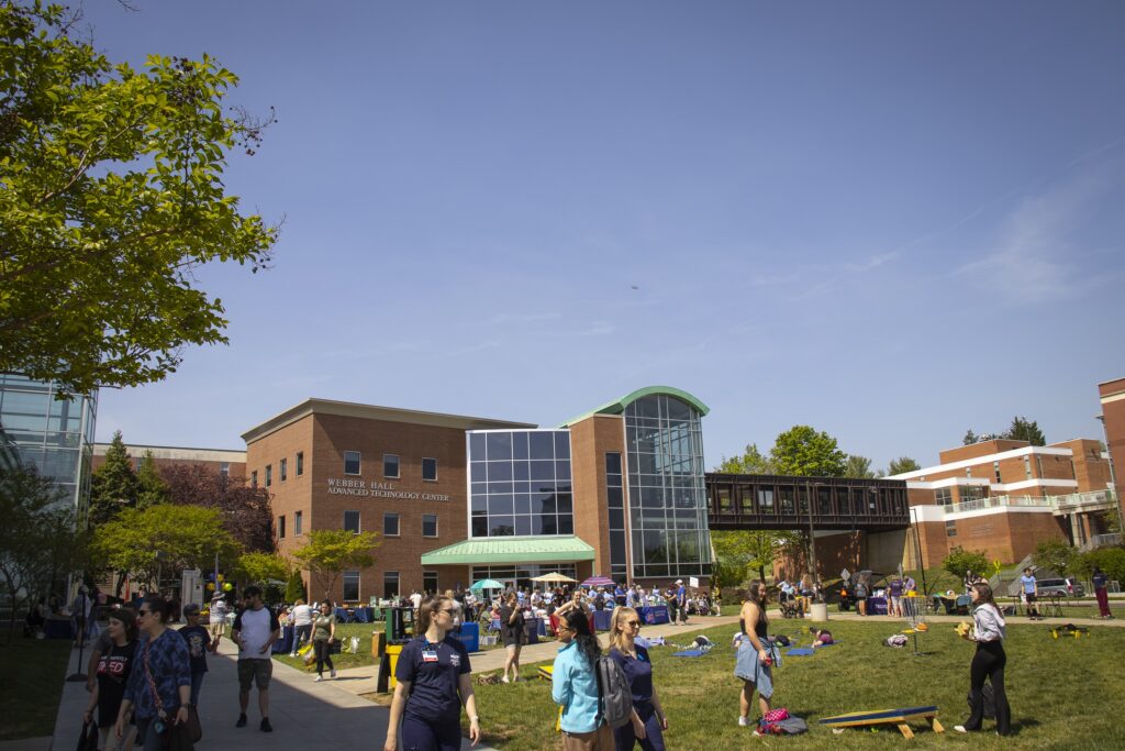 Virginia Western Community College students attend the Spring Fling campus celebration. Students planning to attend Virginia Western in fall 2026 may apply for scholarships by May 1. Free sessions are available in March and April to help with that process.
