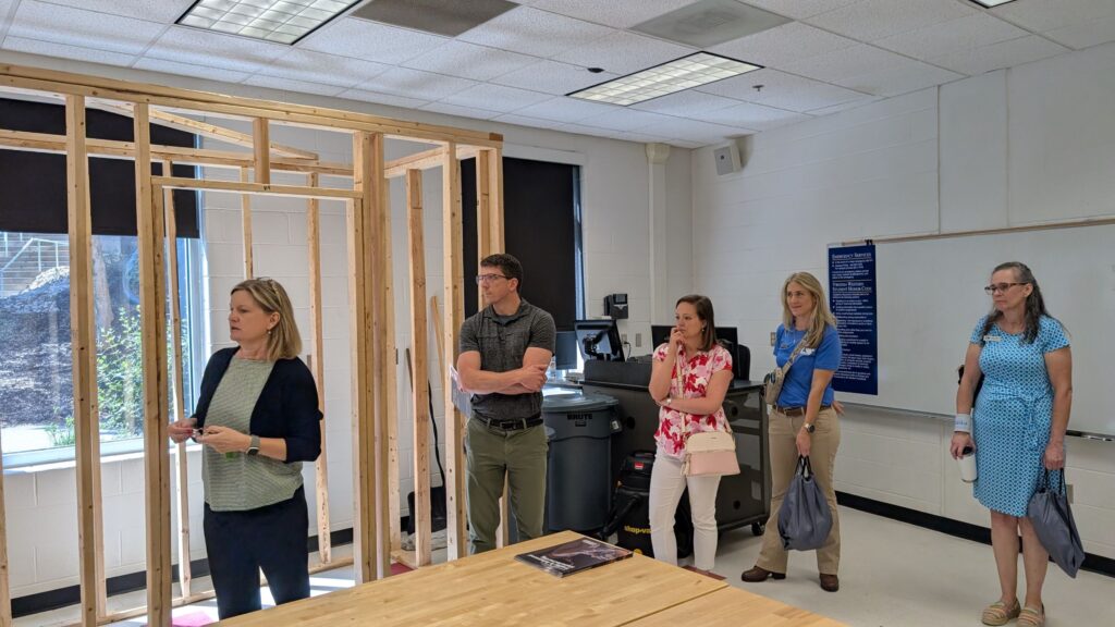 Yvonne Campbell, Dean of Business, Technology and Trades at Virginia Western, leads a tour of construction lab space.