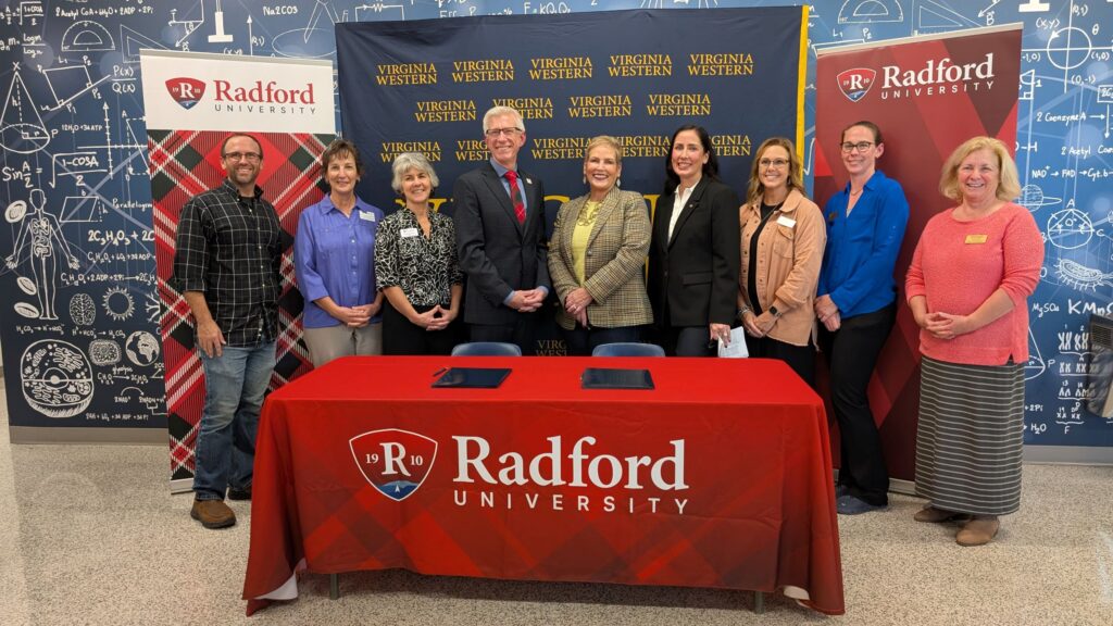 Virginia Western and Radford celebrated the signing of three articulation agreements on Monday, Oct. 12. Pictured from left are Dr. Matt Goff, Health Sciences Program Head at Virginia Western; Laura Link, Interim Associate Dean, Interprofessional Education at Radford; Dr. Christine Small, Dean of Science & Technology; Dr. Bret Danilowicz, Radford University President; Dr. Laura Treanor, Virginia Western Community College President; Crystal Davis, Medical Laboratory Technology Program Head; Susan Nolley, Dean of Health Professions at Virginia Western; Dr. Heather Lindberg, Biotechnology Program Head at Virginia Western; and Amy White, Dean of STEM and Workforce Solutions at Virginia Western.