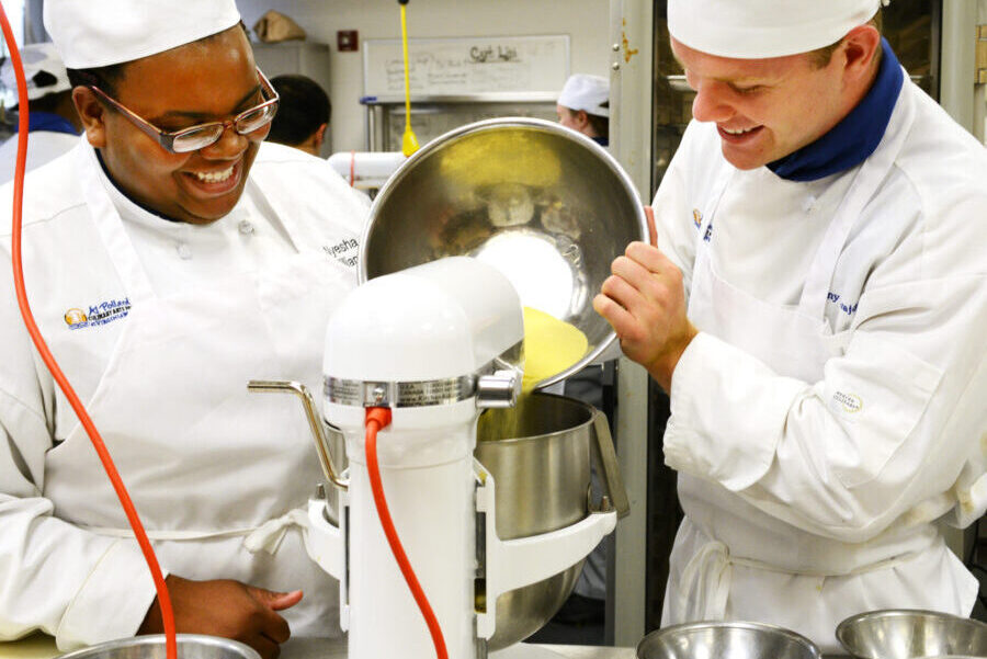 Culinary arts students using a stand mixer