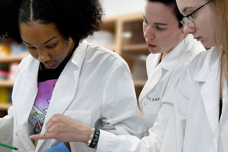 biotechnology students with instructor