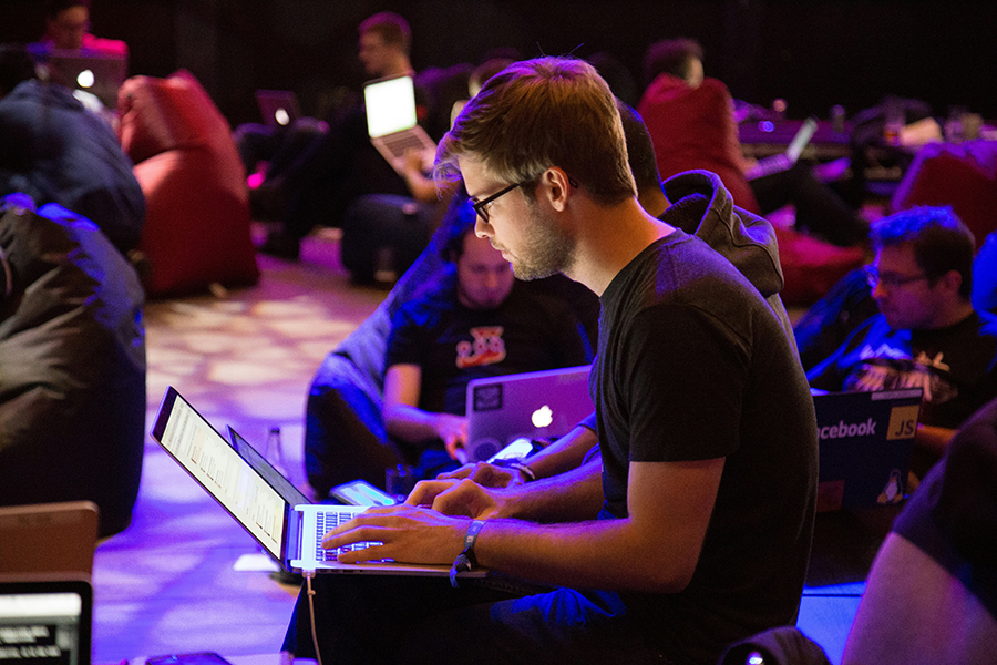 man with laptop at conference