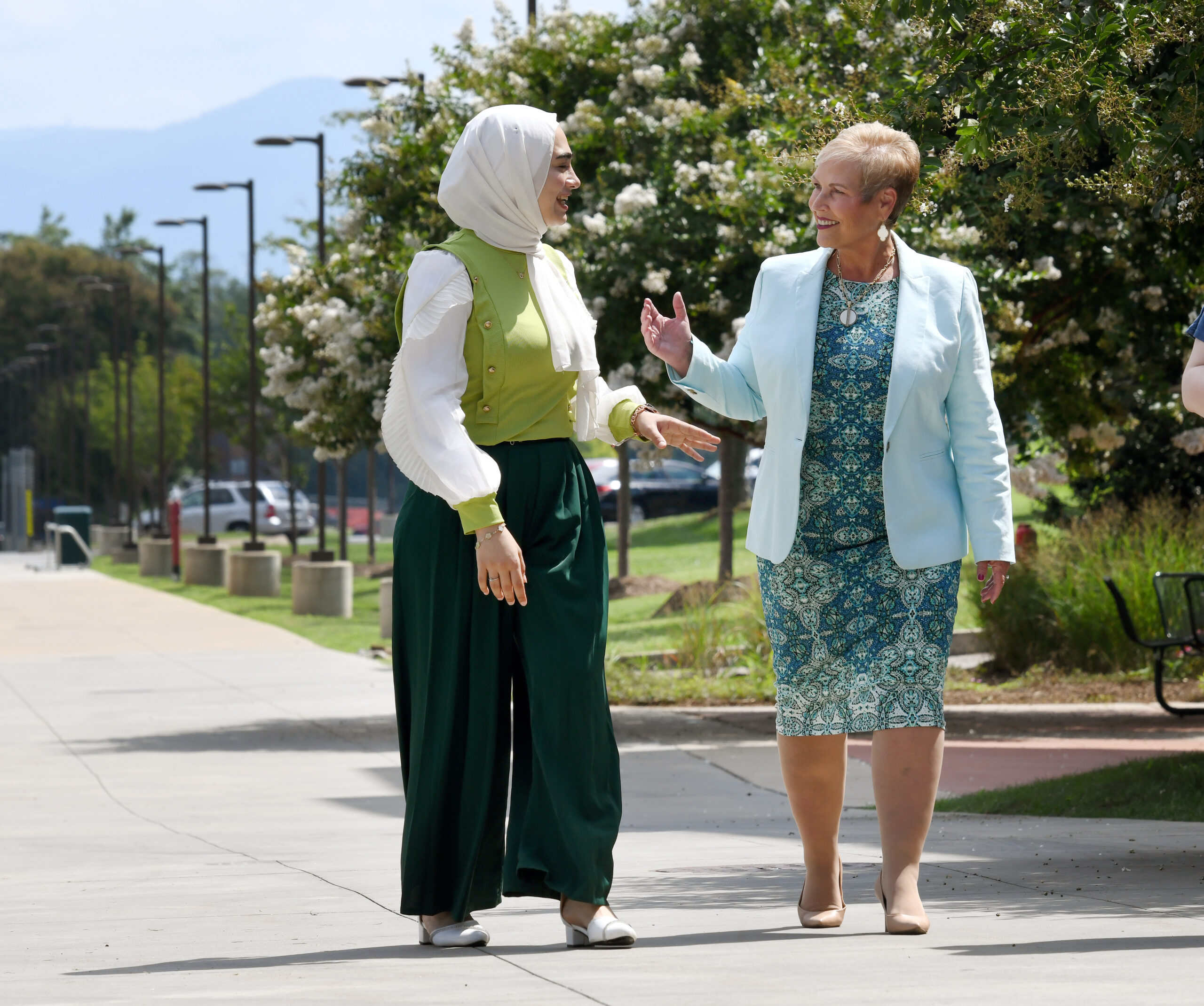 Virginia Western President Dr. Laura Treanor walking with a student
