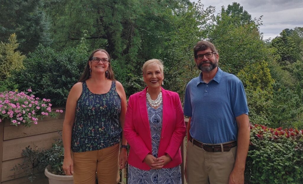 Tonya Judd, Dr. Treanor and Clark BeCraft in the Community Arboretum